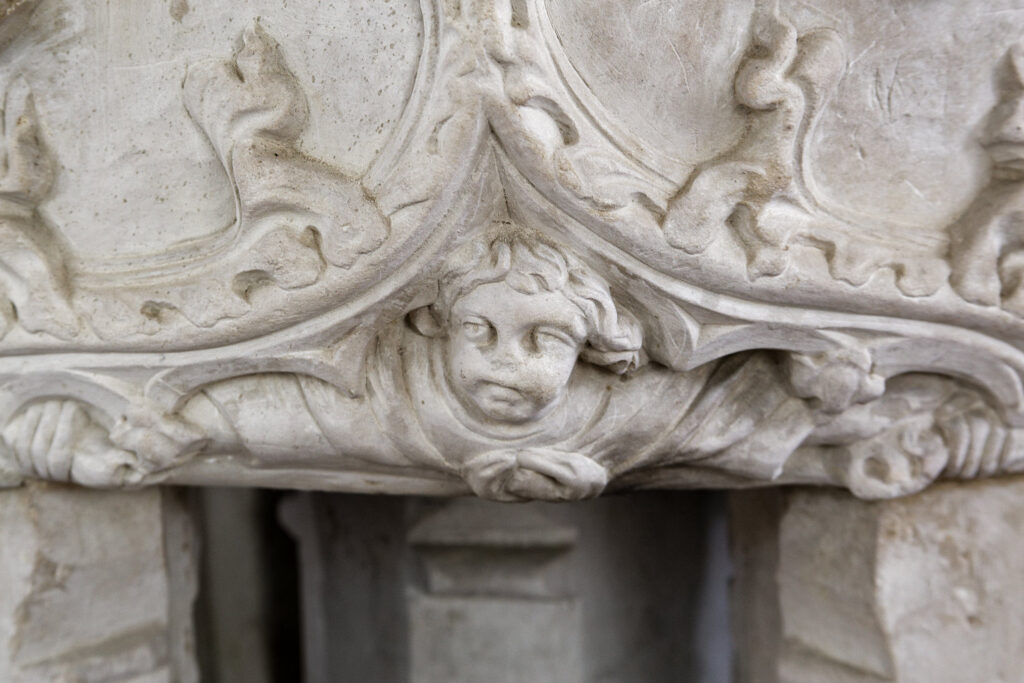 A stone carving of a man's head