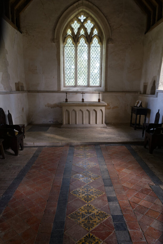 A view of a tiled floor leading to an altar